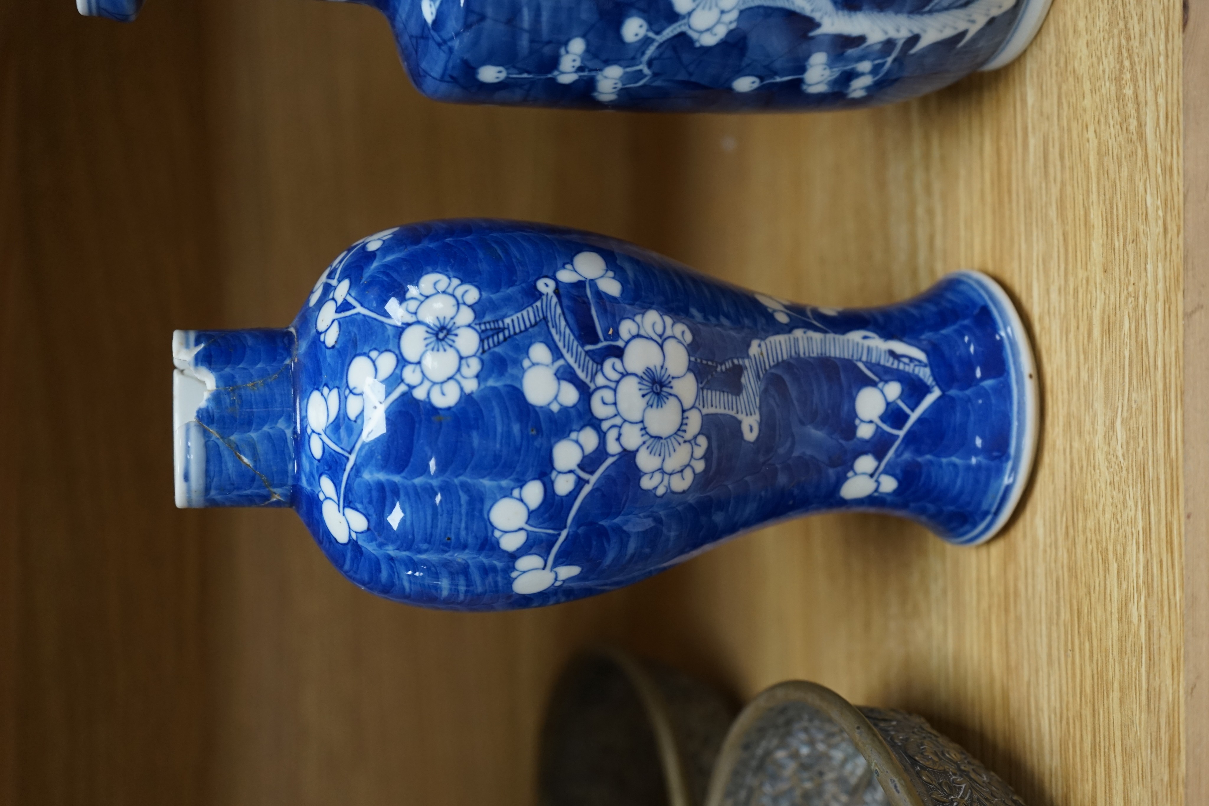 Three Chinese blue and white prunus vases. 25.5cm